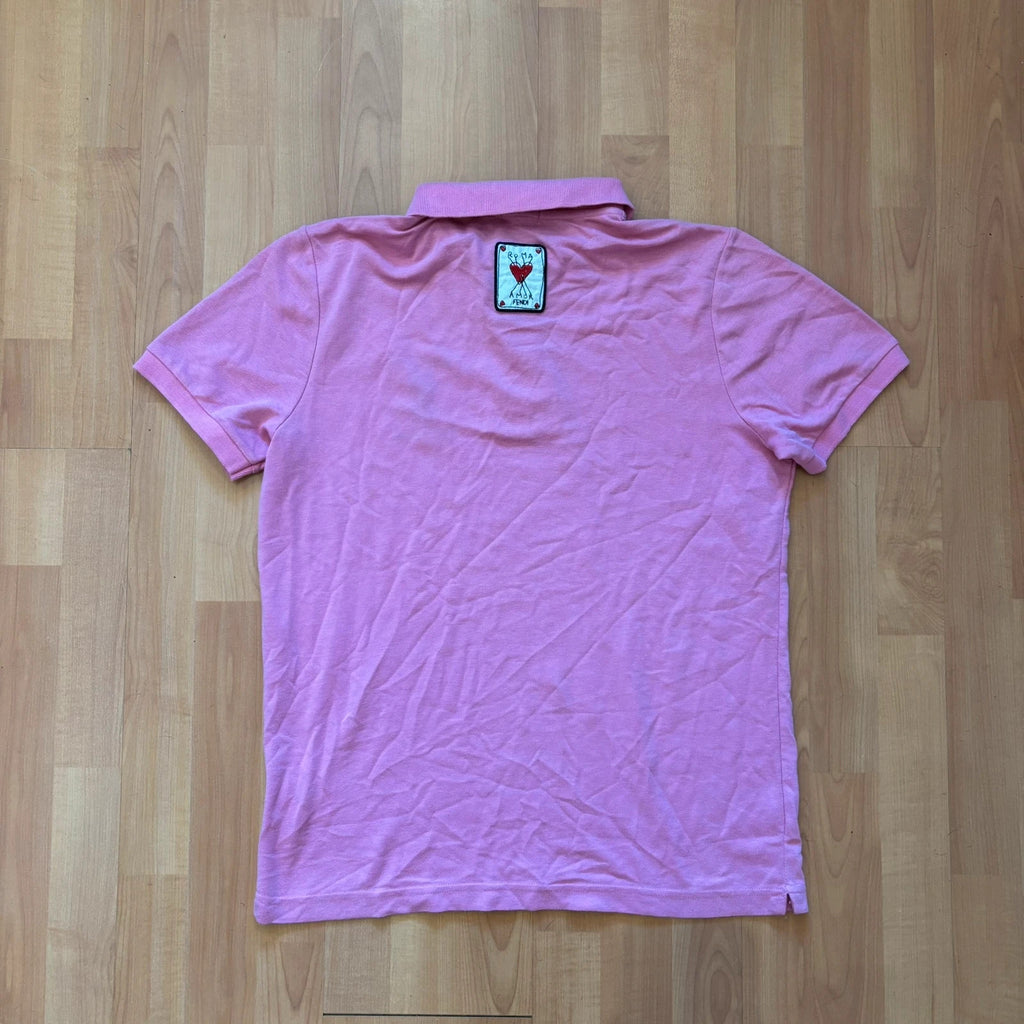 Fendi pink polo shirt with embroidered heart patch and branded buttons, cotton pique fabric.