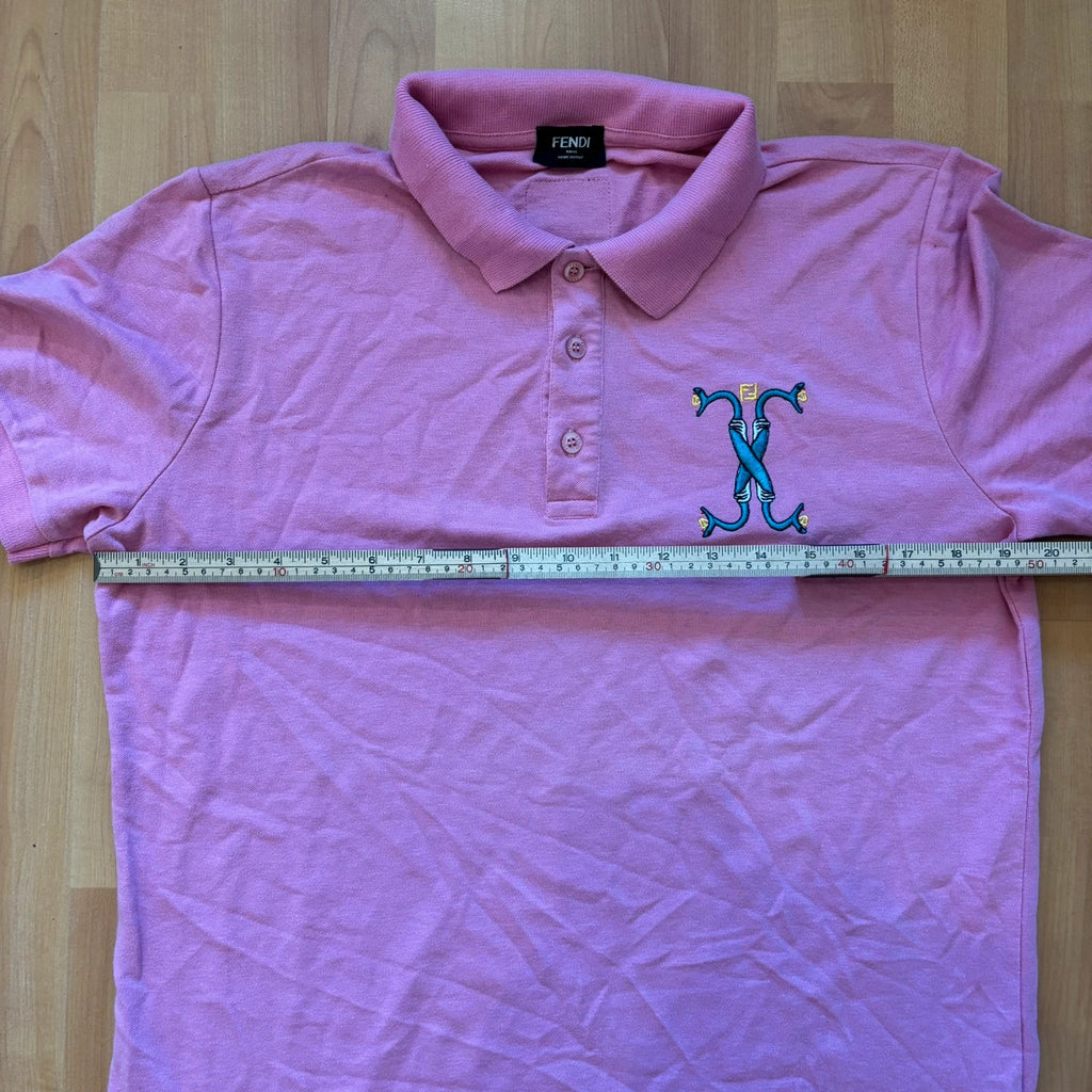 Fendi pink polo shirt with embroidered heart patch and branded buttons, cotton pique fabric.