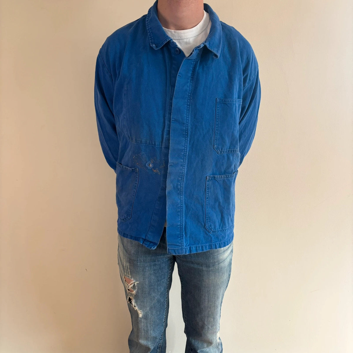 Vintage Dressing blue chore jacket, distressed cotton twill, multiple utility pockets, classic collar.