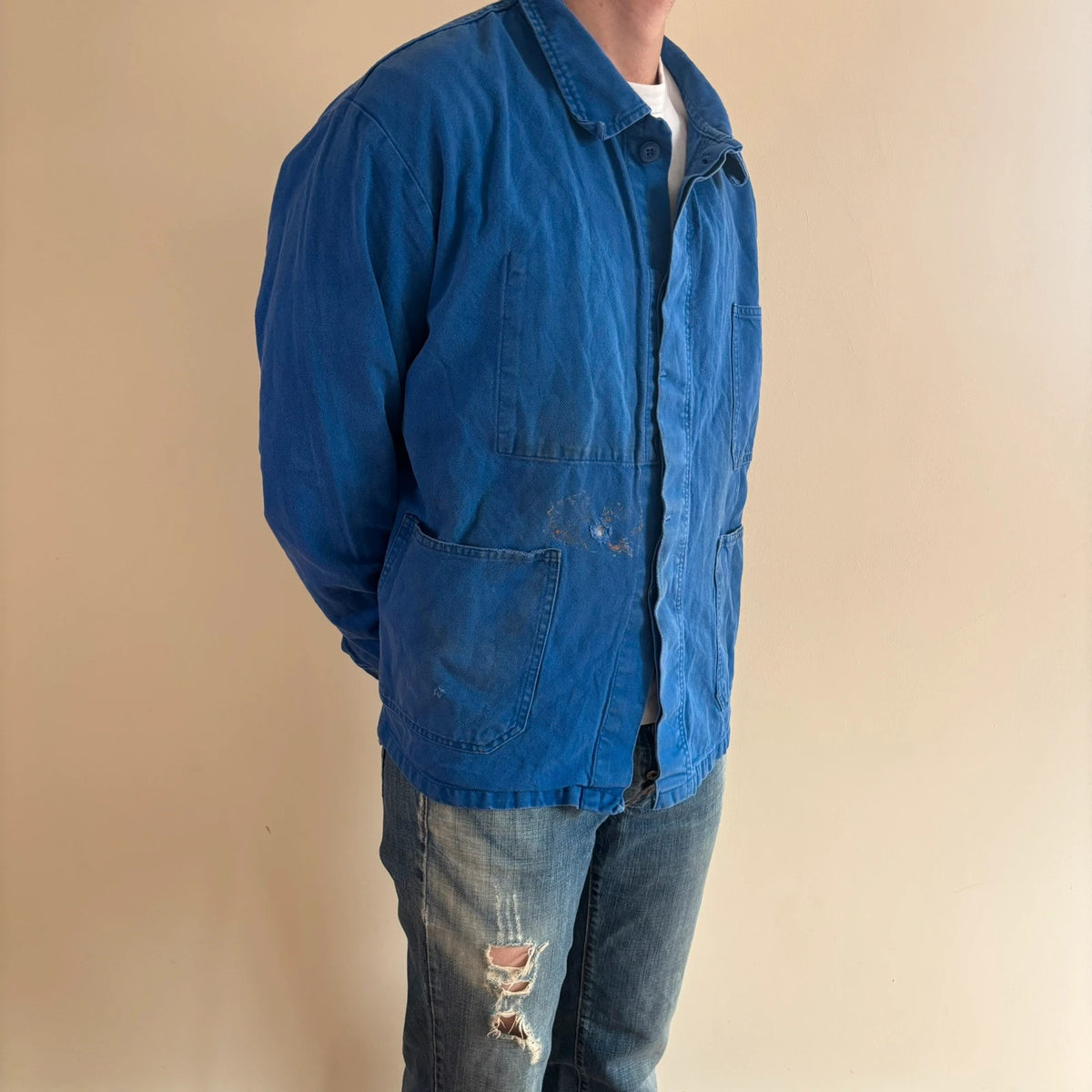 Vintage Dressing blue chore jacket, distressed cotton twill, multiple utility pockets, classic collar.
