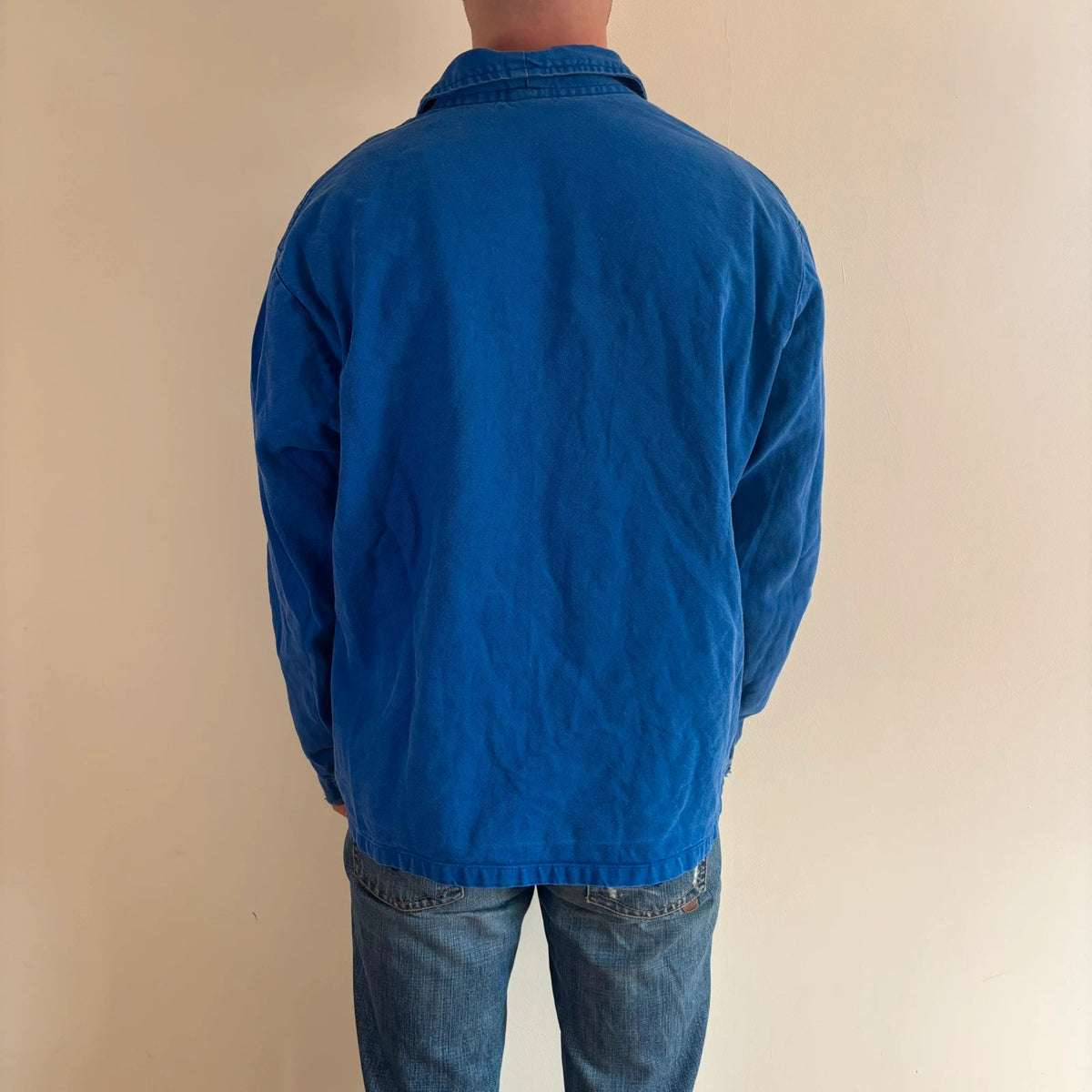 Vintage Dressing blue chore jacket, distressed cotton twill, multiple utility pockets, classic collar.