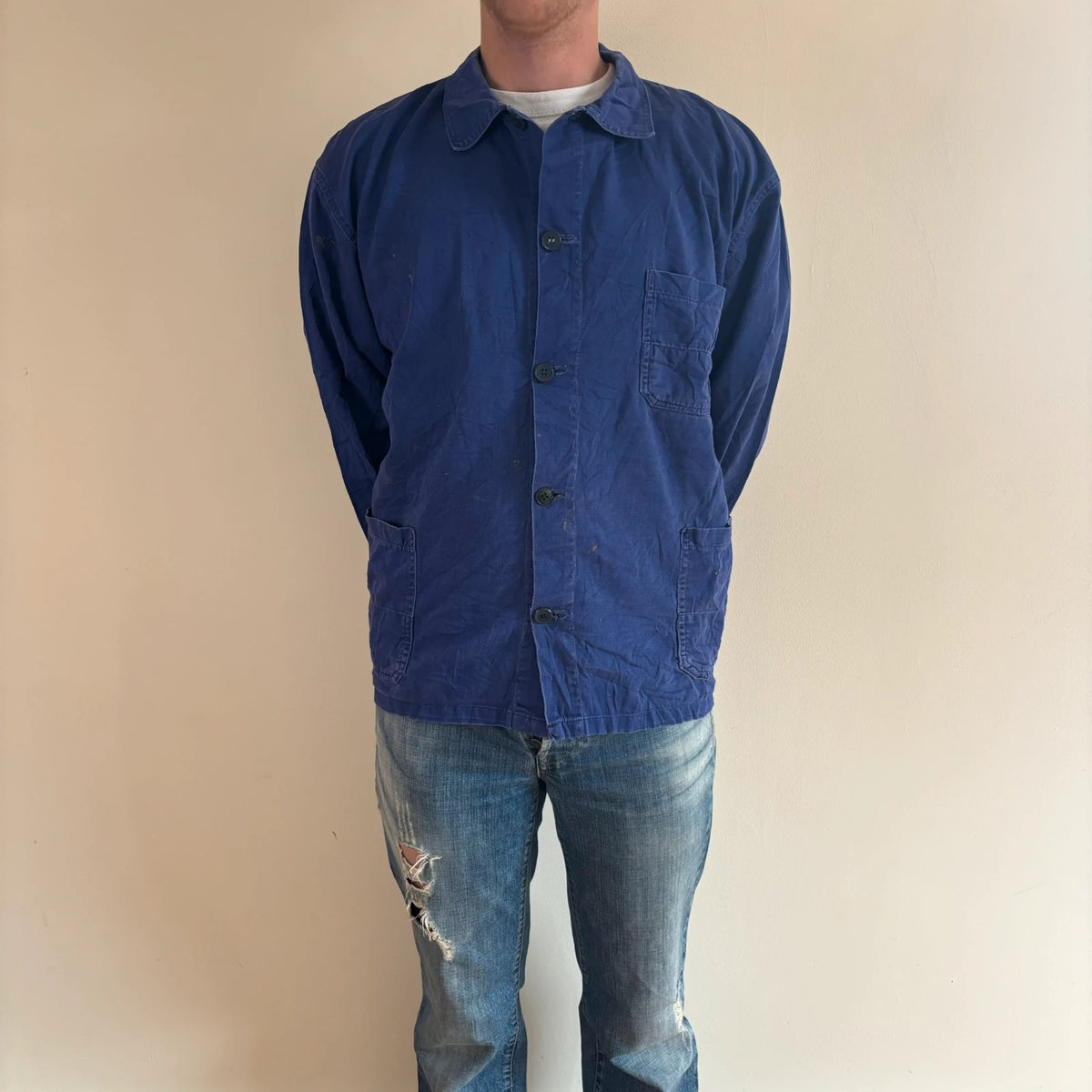 Vintage Dressing blue chore coat with multiple patch pockets and rugged button closures.