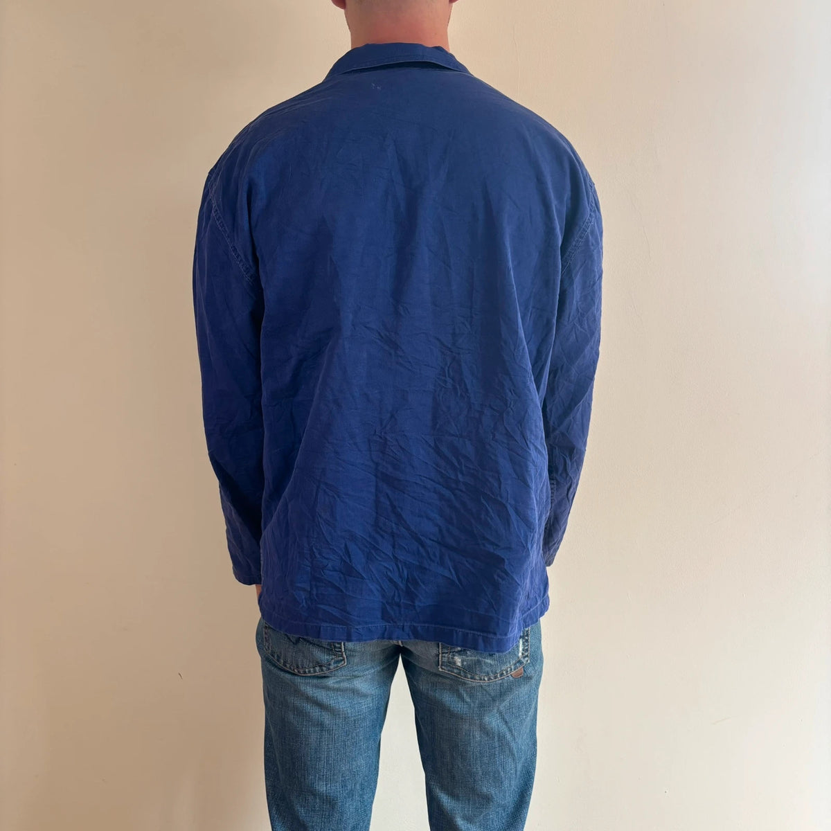 Vintage Dressing blue chore coat with multiple patch pockets and rugged button closures.
