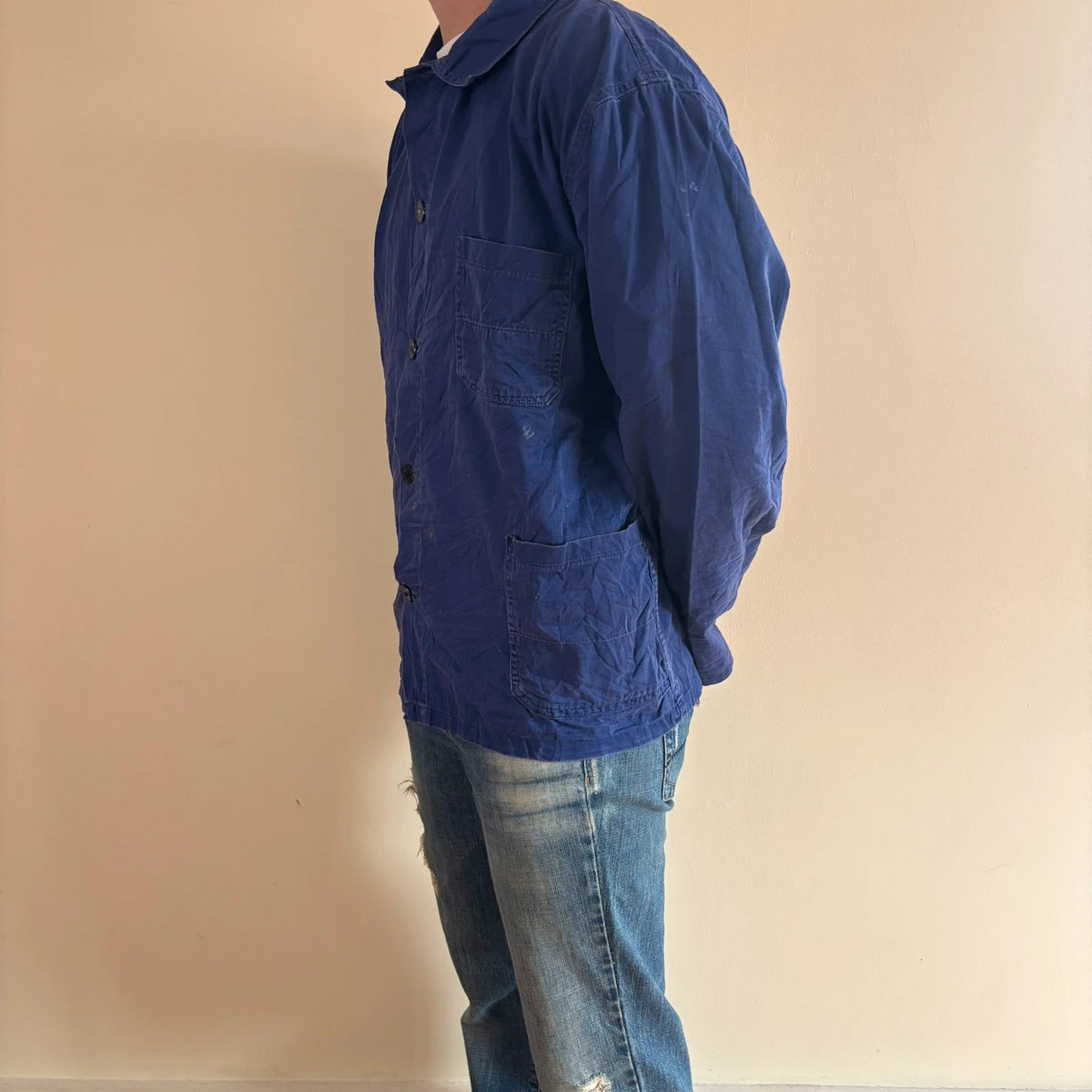 Vintage Dressing blue chore coat with multiple patch pockets and rugged button closures.