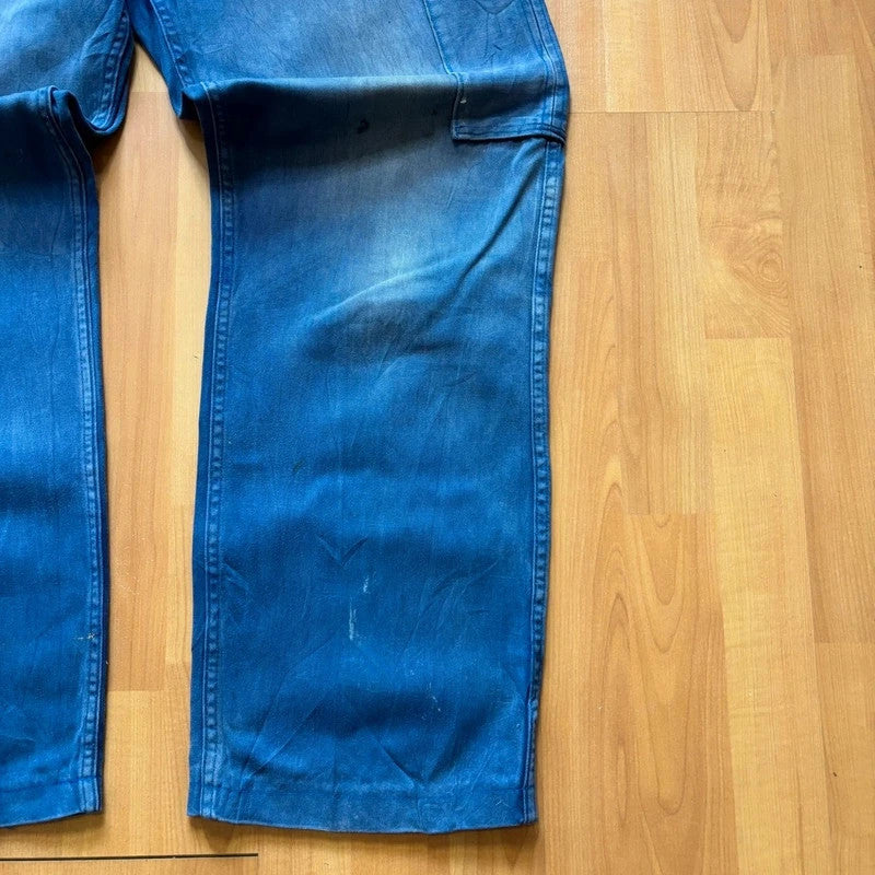 Vintage Dressing blue wide-leg trousers with knee patch and classic utility side pocket.