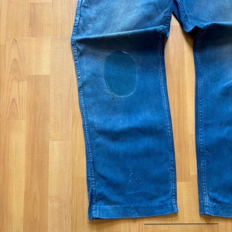Vintage Dressing blue wide-leg trousers with knee patch and classic utility side pocket.