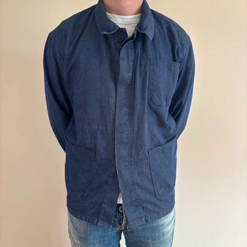 Vintage Dressing blue chore jacket with pointed collar, button front, and utility patch pockets.