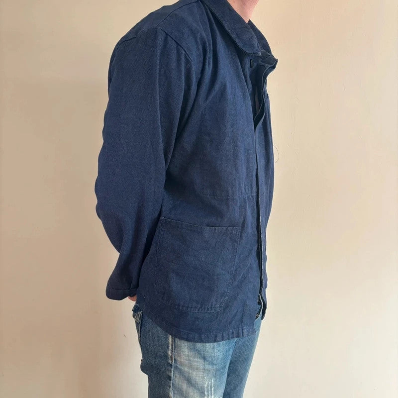 Vintage Dressing blue chore jacket with pointed collar, button front, and utility patch pockets.