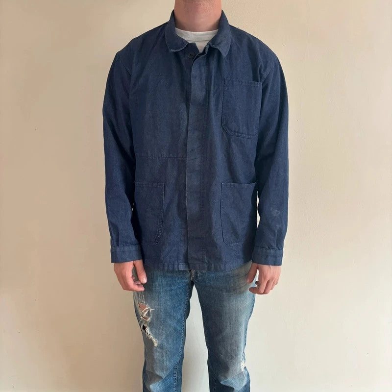 Vintage Dressing blue chore jacket with pointed collar, button front, and utility patch pockets.
