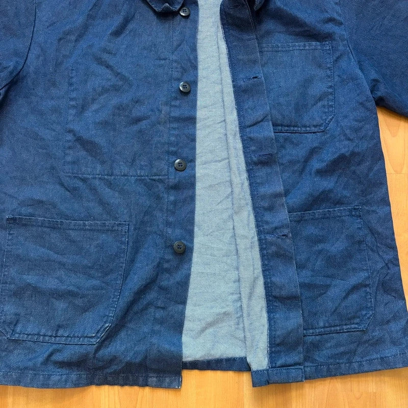 Vintage Dressing blue chore jacket with pointed collar, button front, and utility patch pockets.
