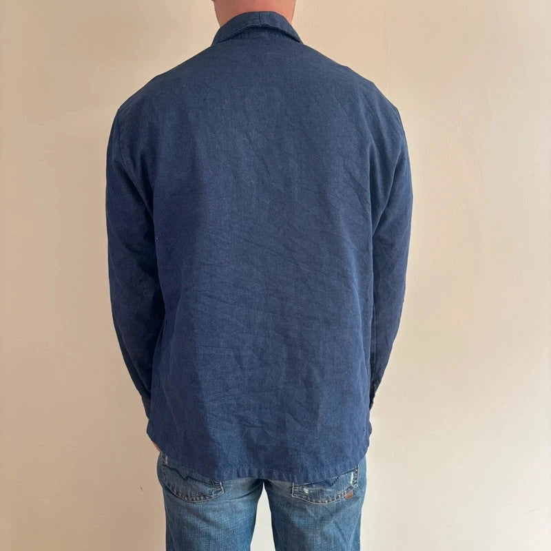 Vintage Dressing blue chore jacket with pointed collar, button front, and utility patch pockets.