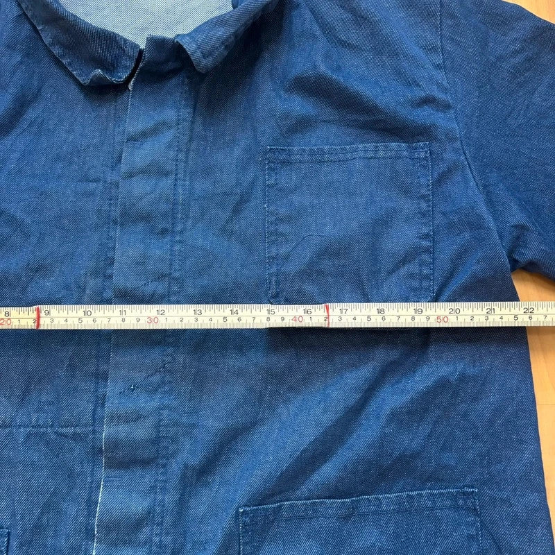 Vintage Dressing blue chore jacket with pointed collar, button front, and utility patch pockets.