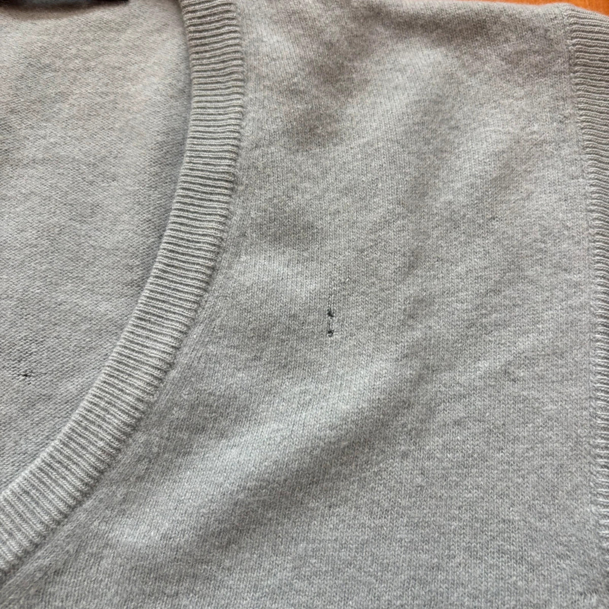 Yves Saint Laurent blue knitted vest with embroidered logo and ribbed detailing.