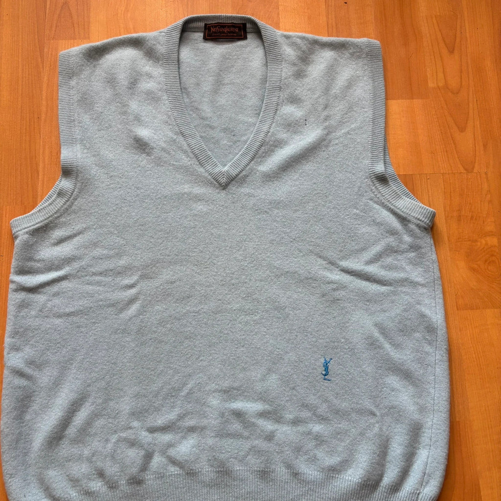 Yves Saint Laurent blue knitted vest with embroidered logo and ribbed detailing.