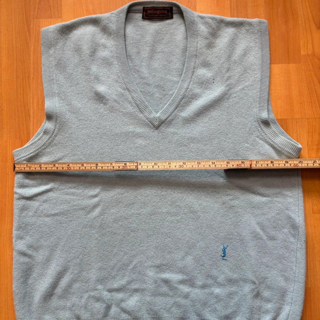 Yves Saint Laurent blue knitted vest with embroidered logo and ribbed detailing.