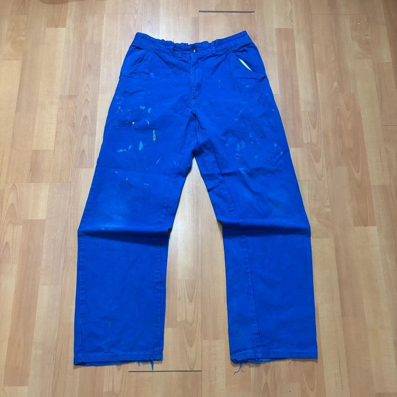 Vintage Dressing blue wide-leg trousers with paint splatters and elasticated waistband.