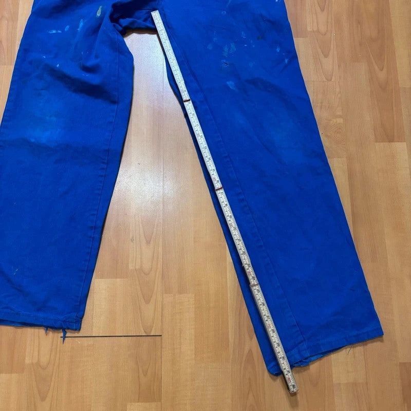 Vintage Dressing blue wide-leg trousers with paint splatters and elasticated waistband.