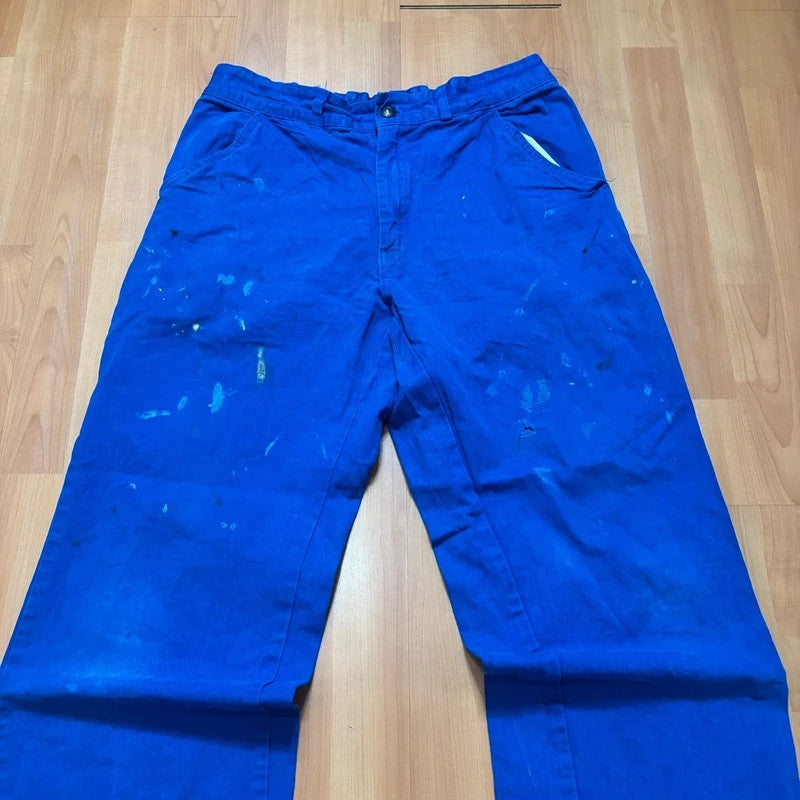 Vintage Dressing blue wide-leg trousers with paint splatters and elasticated waistband.