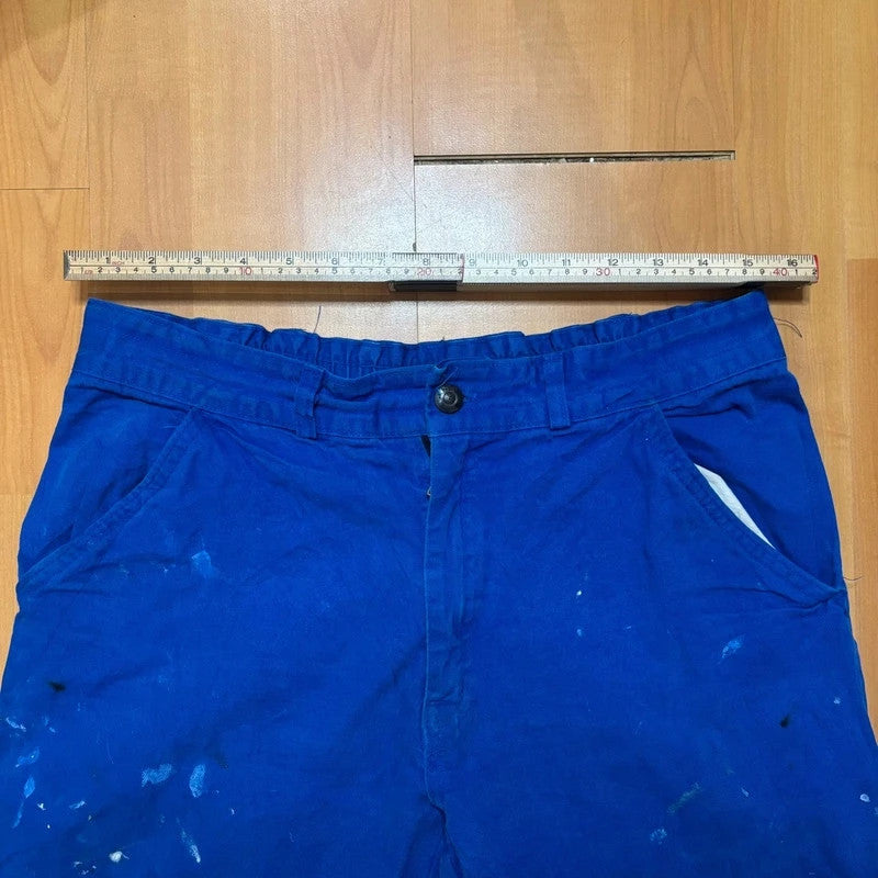 Vintage Dressing blue wide-leg trousers with paint splatters and elasticated waistband.