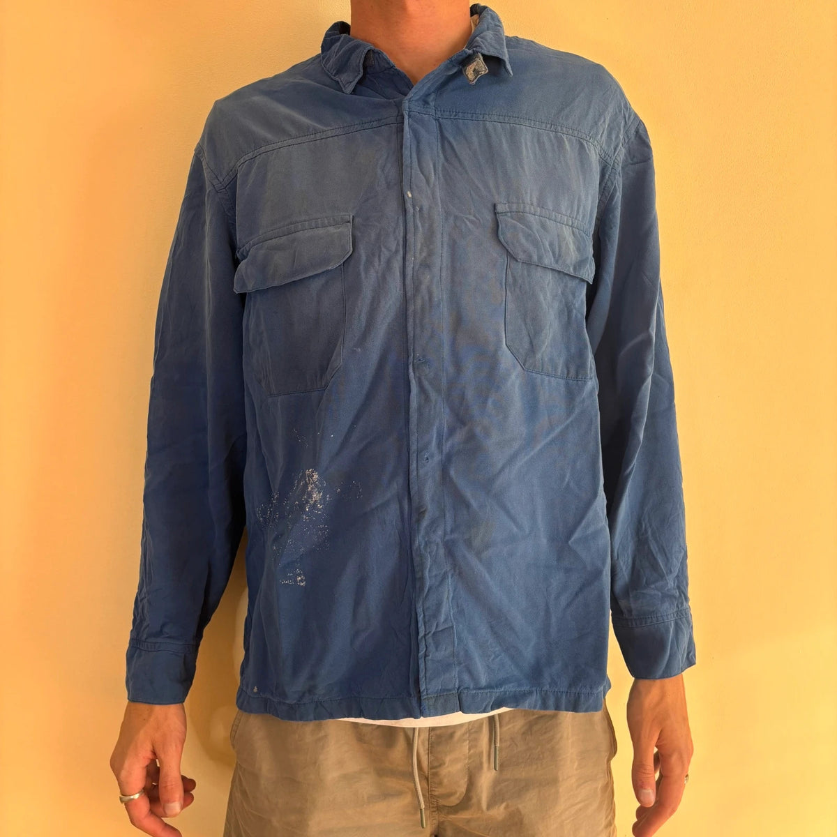 Vintage Dressing blue workwear jacket with snap-button closures and "Steel-Tec" back patch.