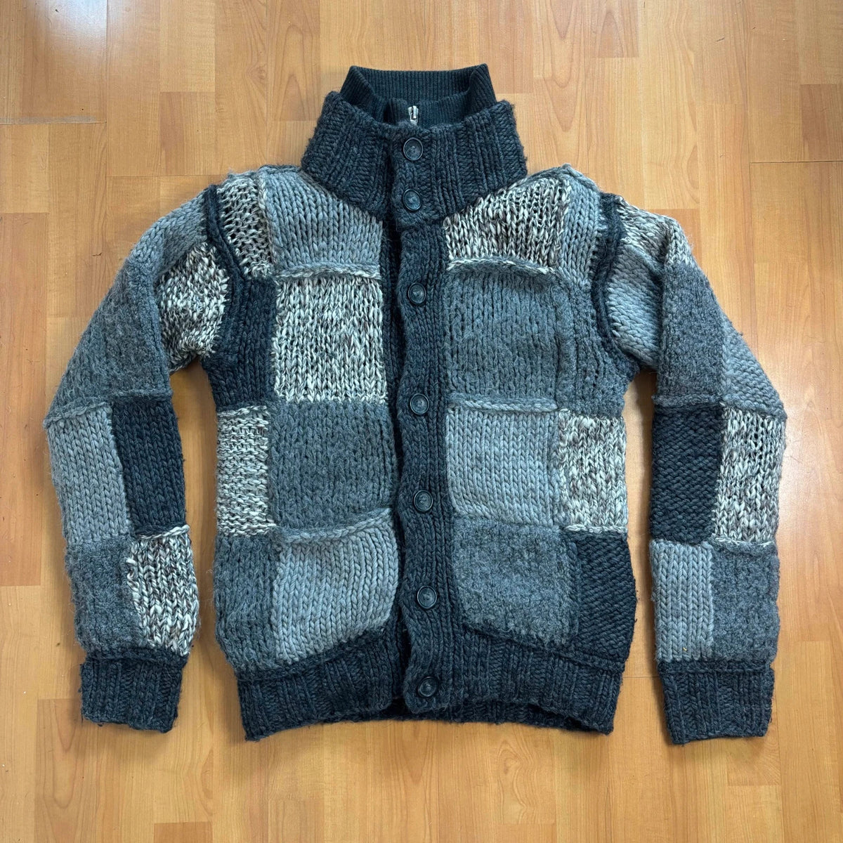 Dolce & Gabbana black and grey chunky knit cardigan with removable quilted bomber jacket.