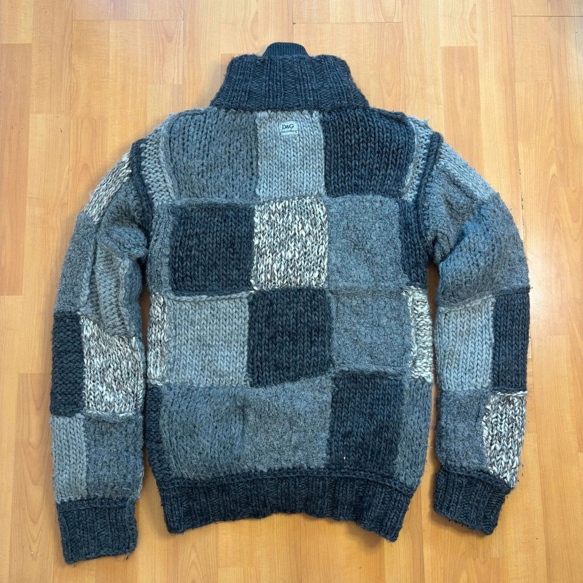 Dolce & Gabbana black and grey chunky knit cardigan with removable quilted bomber jacket.