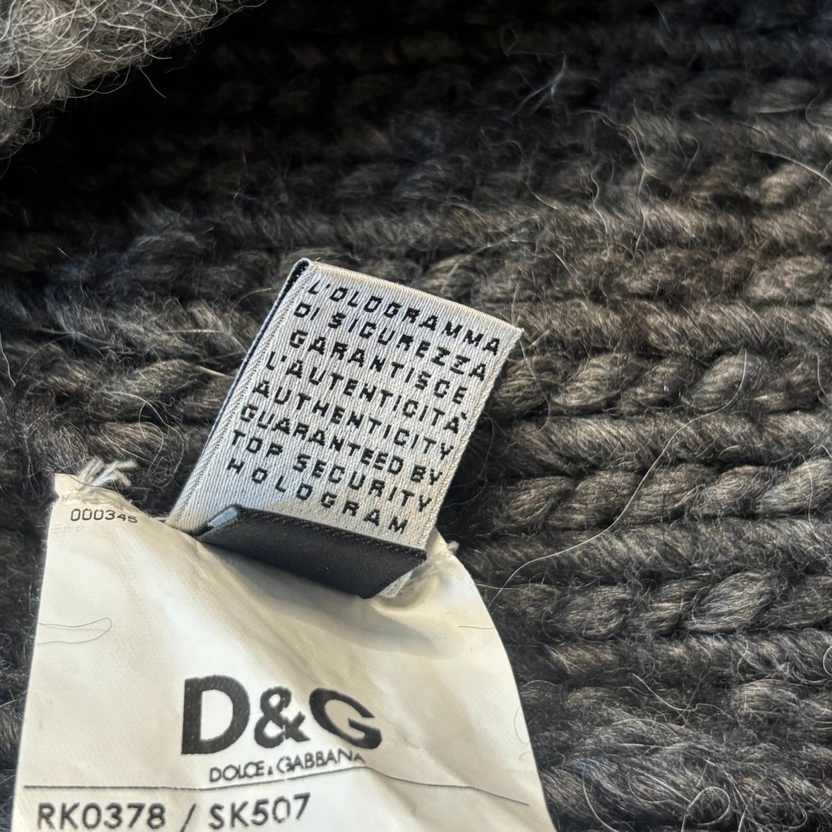 Dolce & Gabbana black and grey chunky knit cardigan with removable quilted bomber jacket.