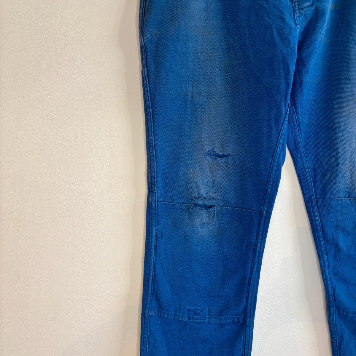 Vintage Dressing blue wide-leg trousers with double knees and utility pocket detailing.