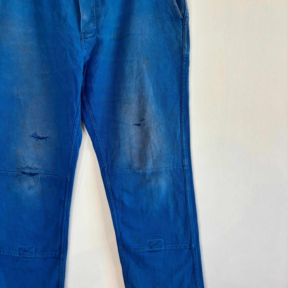 Vintage Dressing blue wide-leg trousers with double knees and utility pocket detailing.