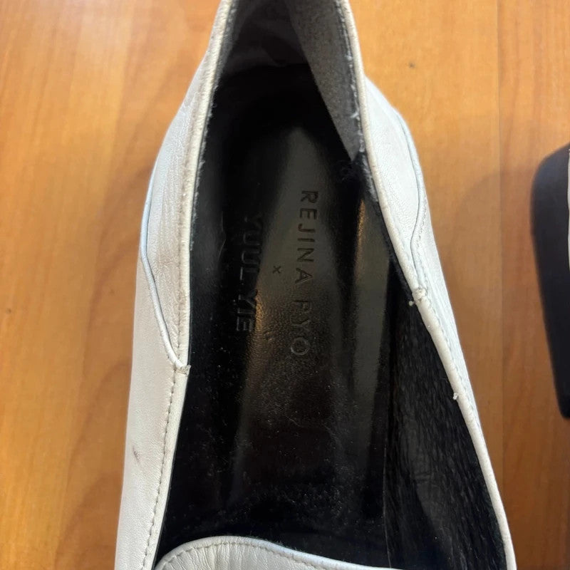 YUUL YIE white leather pointed toe heels with hardware ring detail and low block heel.