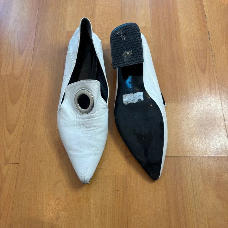 YUUL YIE white leather pointed toe heels with hardware ring detail and low block heel.