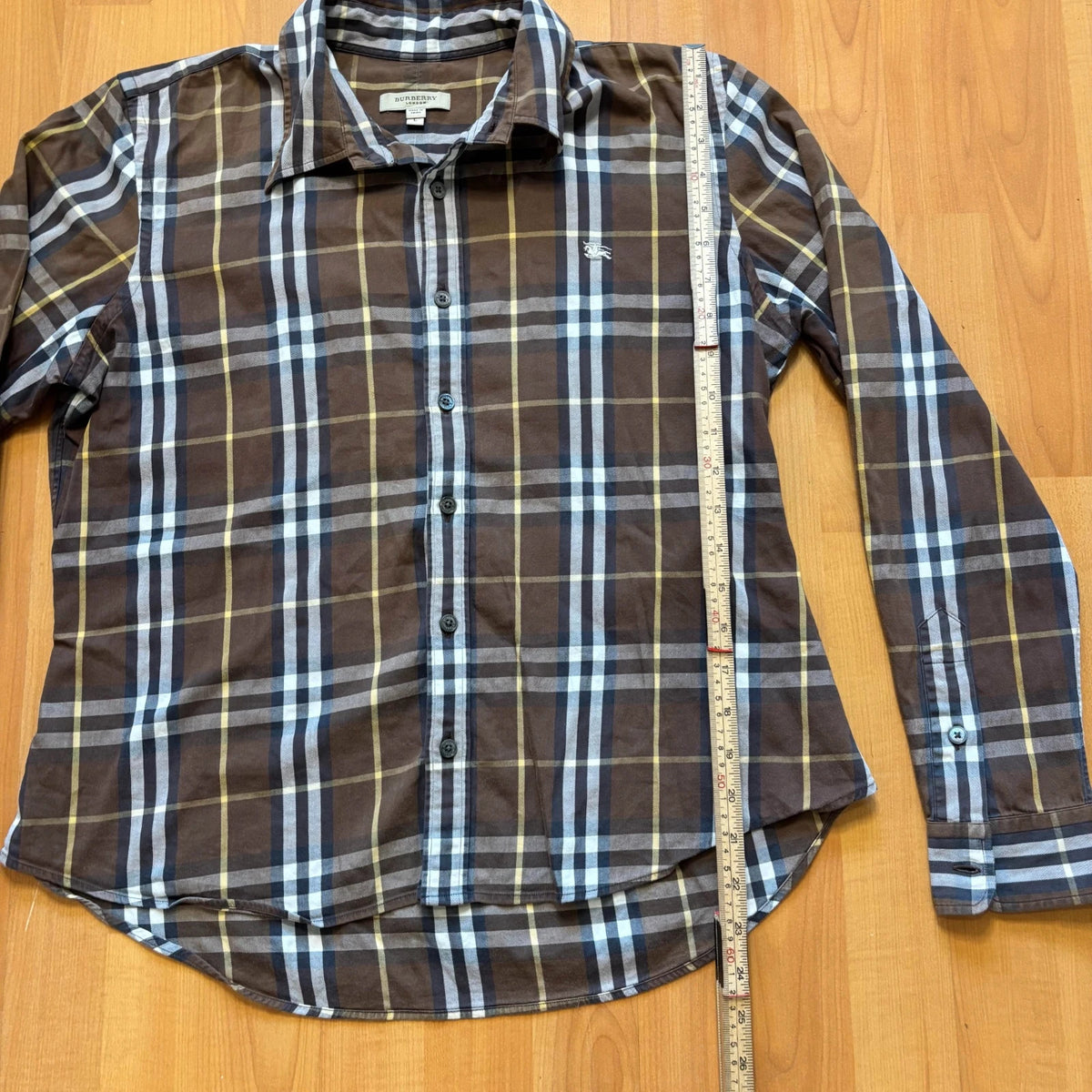 Burberry men's button-up shirt blue and brown plaid with knight logo embroidered on chest.
