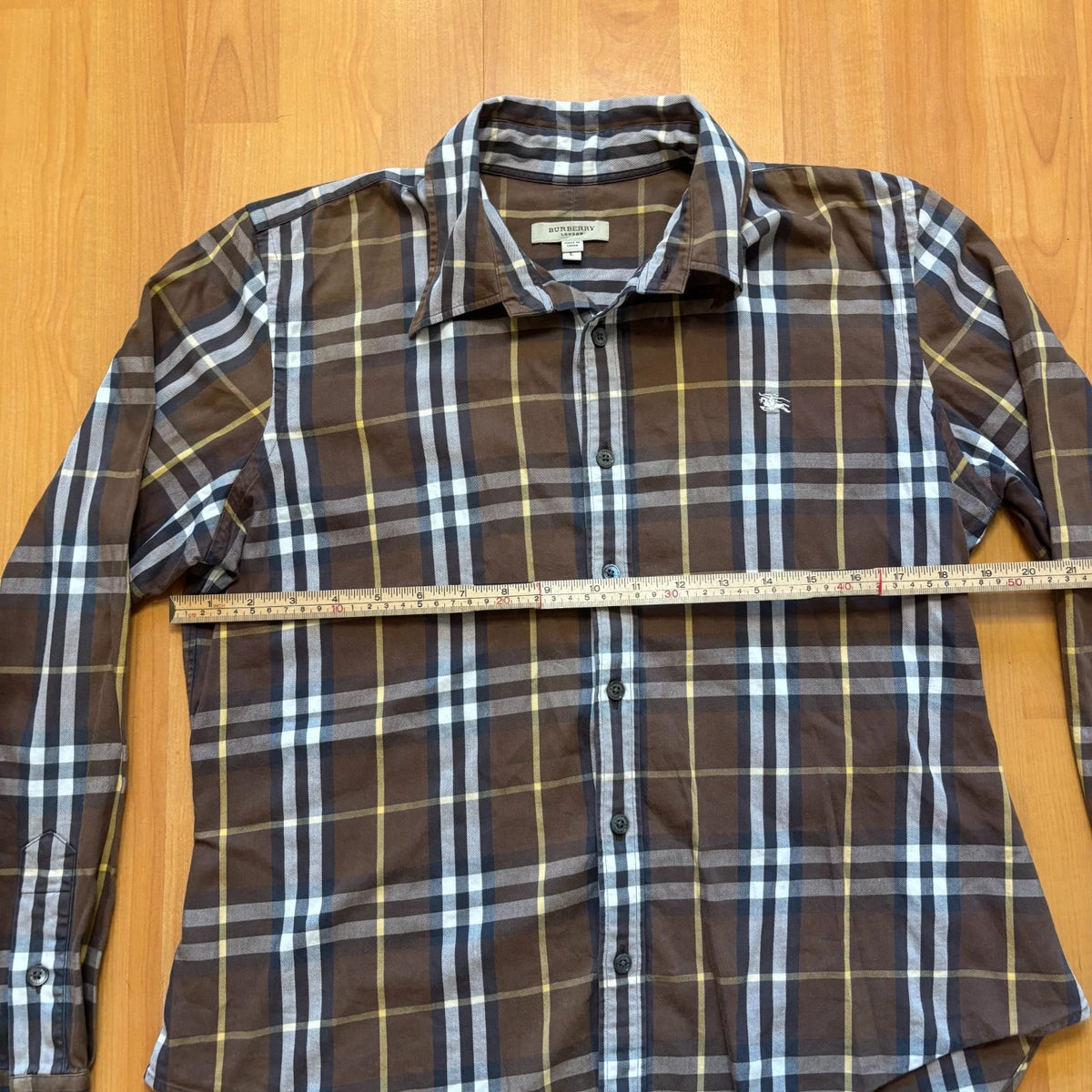 Burberry men's button-up shirt blue and brown plaid with knight logo embroidered on chest.