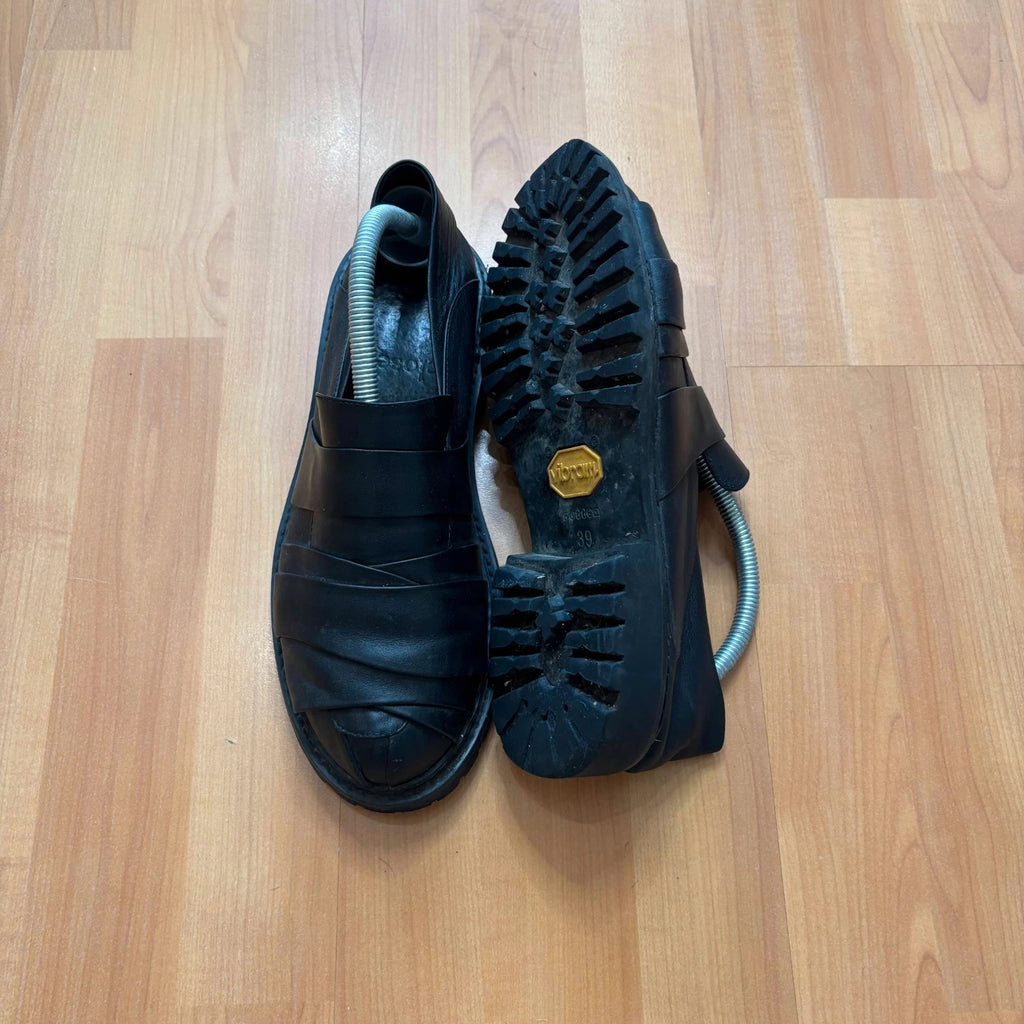 Rotten Closet black leather Morph Mules with collapsible heel and rugged vibram soles.