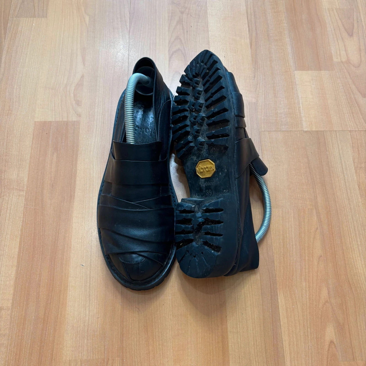 Rotten Closet black leather Morph Mules with collapsible heel and rugged vibram soles.