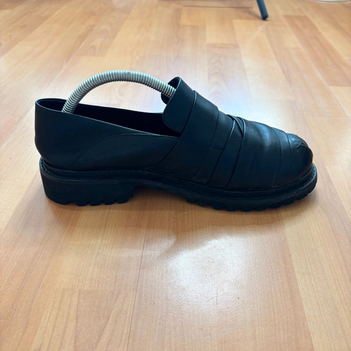 Rotten Closet black leather Morph Mules with collapsible heel and rugged vibram soles.