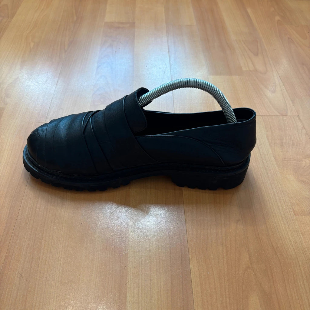 Rotten Closet black leather Morph Mules with collapsible heel and rugged vibram soles.