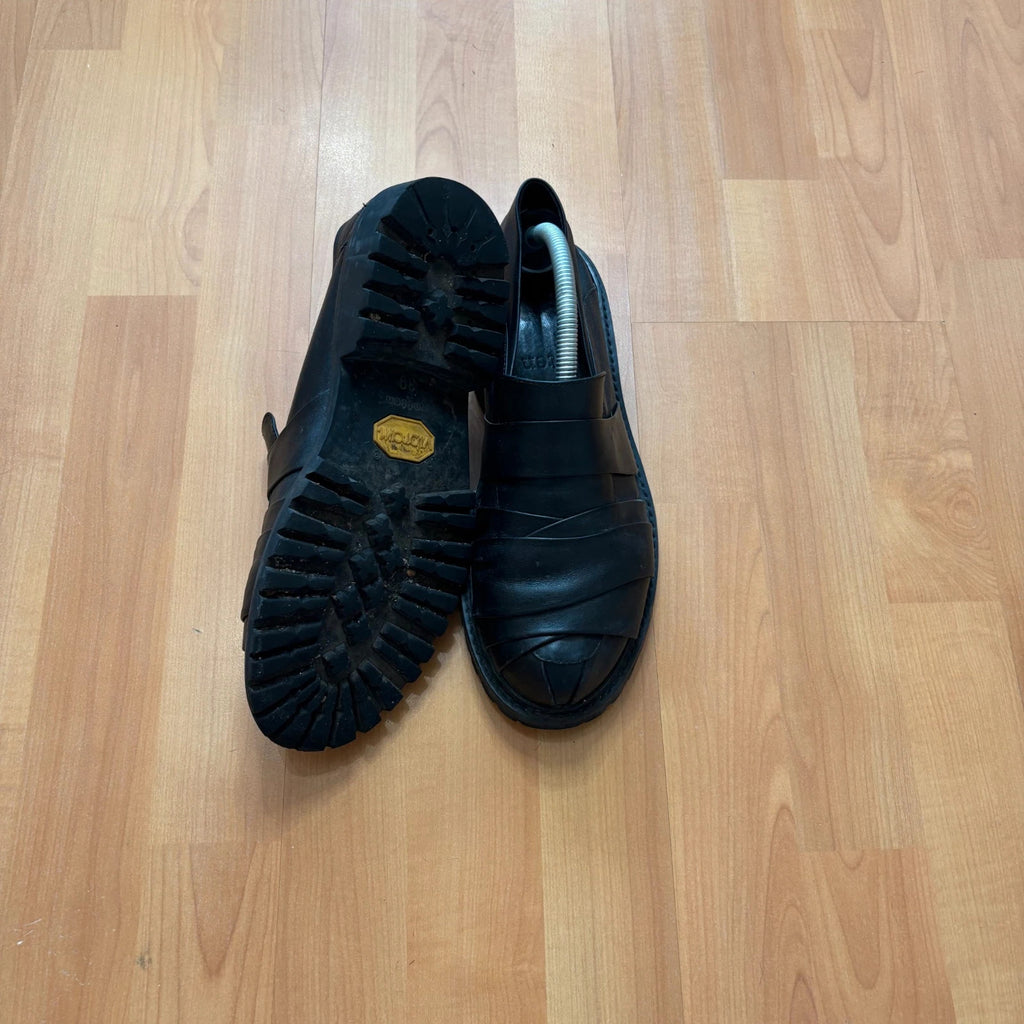 Rotten Closet black leather Morph Mules with collapsible heel and rugged vibram soles.