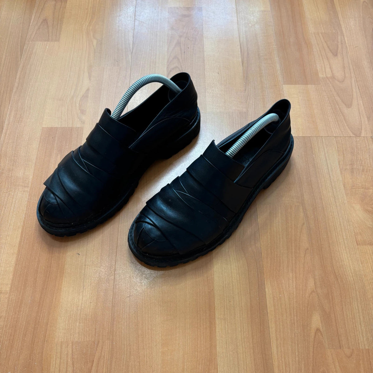 Rotten Closet black leather Morph Mules with collapsible heel and rugged vibram soles.