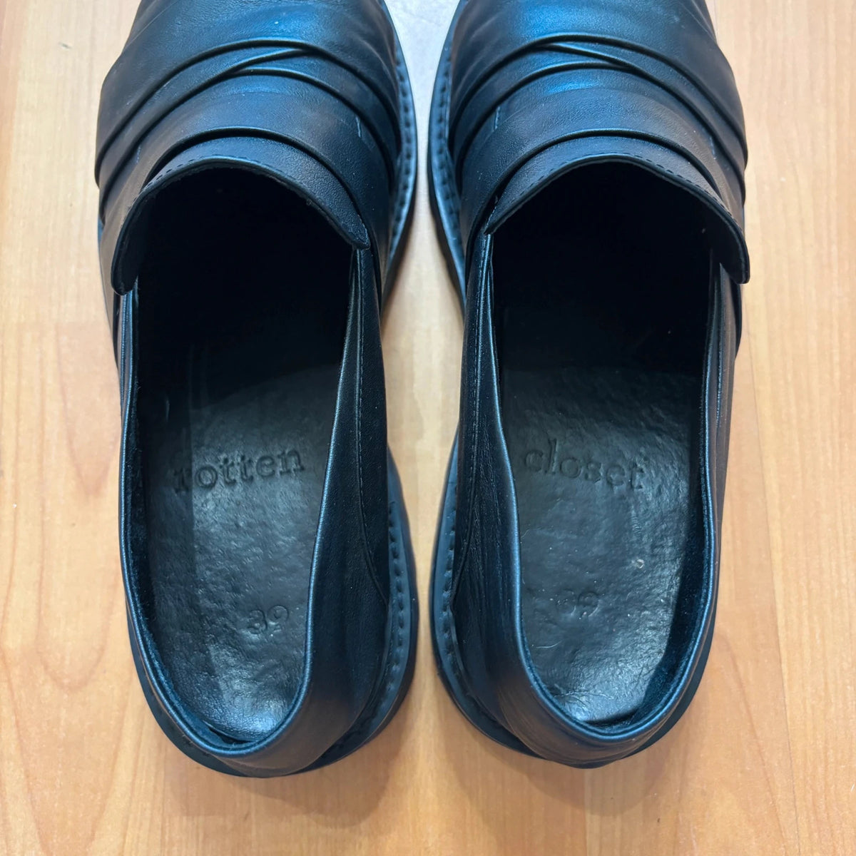 Rotten Closet black leather Morph Mules with collapsible heel and rugged vibram soles.
