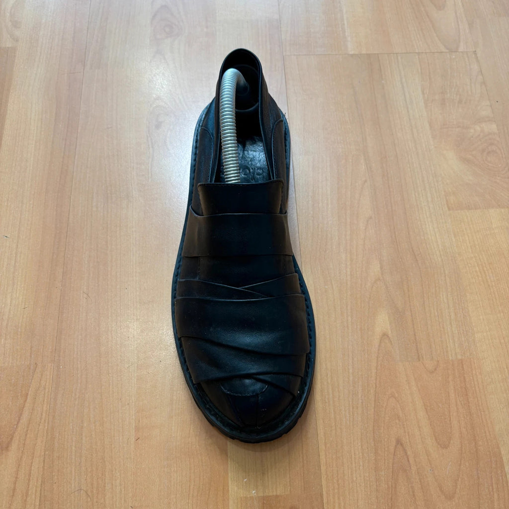Rotten Closet black leather Morph Mules with collapsible heel and rugged vibram soles.