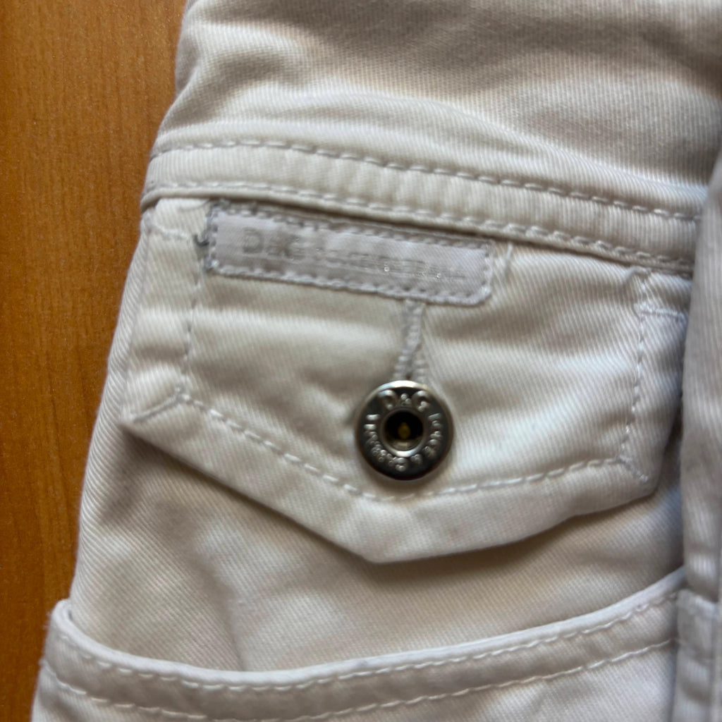 Dolce & Gabbana white denim mini skirt with utility pockets and branded hardware.