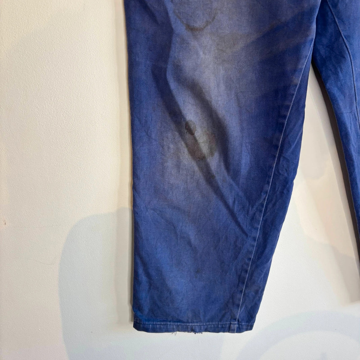 Vintage Dressing navy wide-leg trousers with embroidered logo patch and super-distressed moleskin fabric.