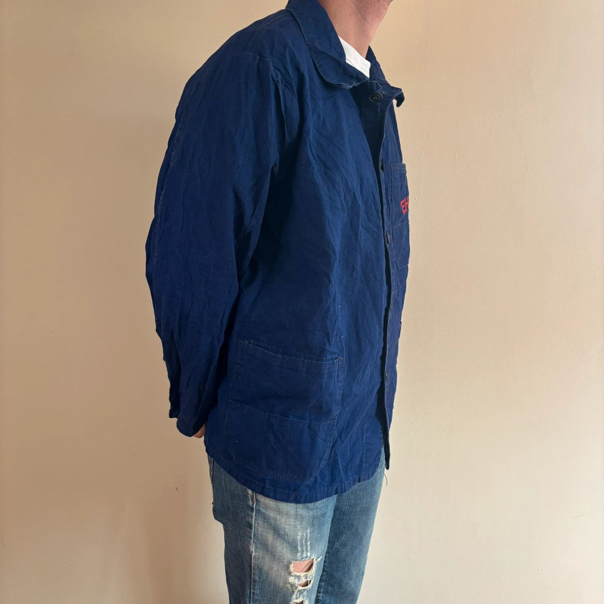 Sanfor blue chore coat with red "EHW" chainstitch embroidery and classic collar.