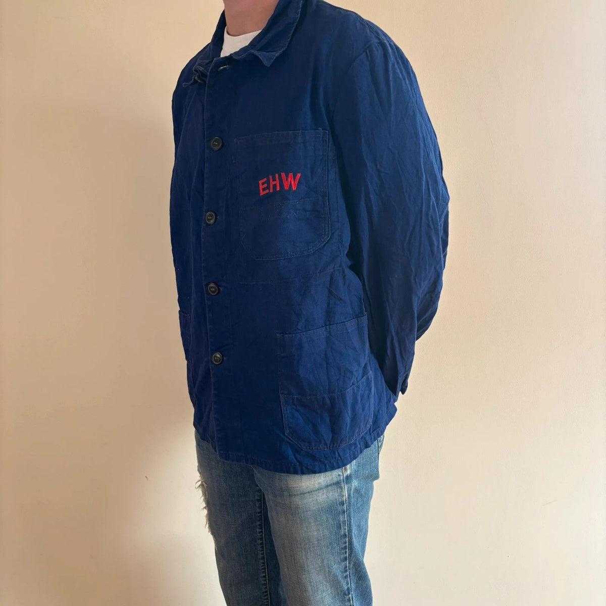 Sanfor blue chore coat with red "EHW" chainstitch embroidery and classic collar.