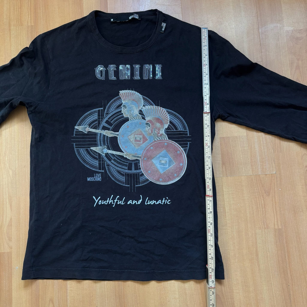 Love Moschino black long sleeve t-shirt with Gemini graphic, ribbed crew neckline, 100% cotton.
