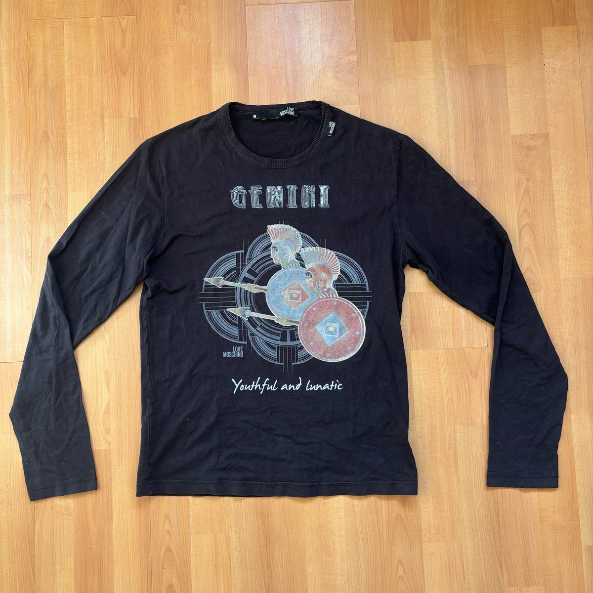 Love Moschino black long sleeve t-shirt with Gemini graphic, ribbed crew neckline, 100% cotton.