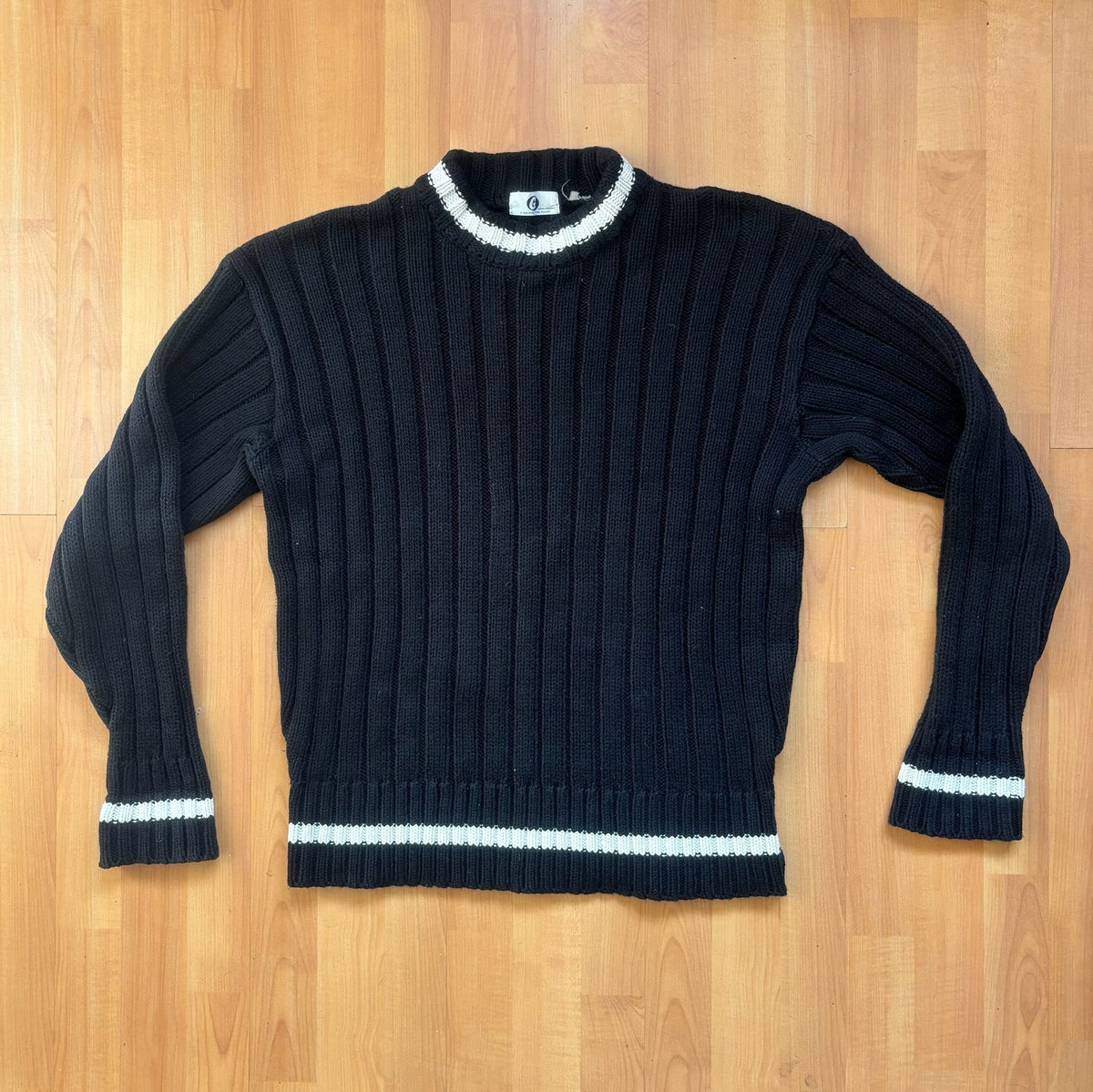 GOOD ENOUGH black and white knitted fisherman sweater with ribbed texture and striped collar.