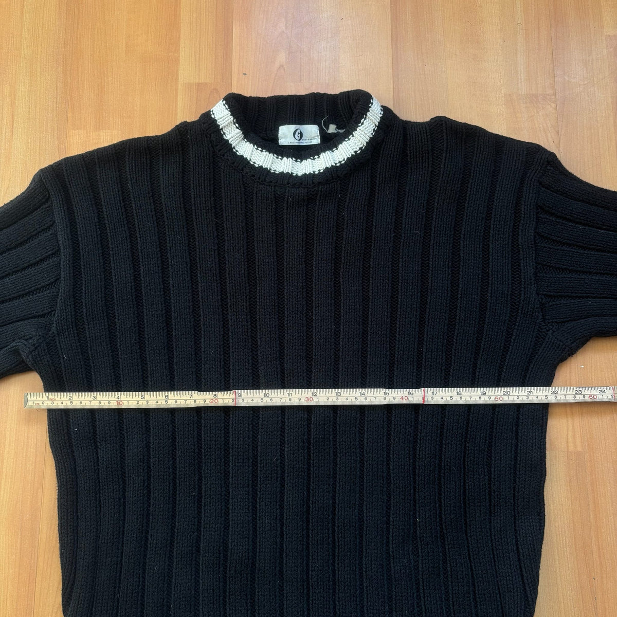 GOOD ENOUGH black and white knitted fisherman sweater with ribbed texture and striped collar.
