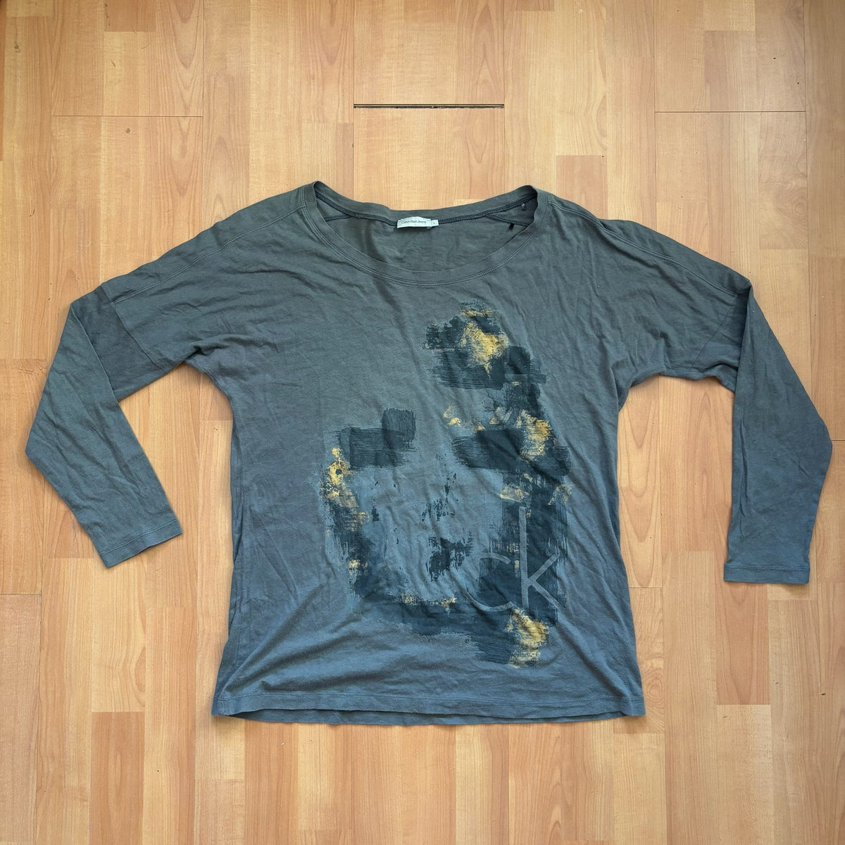 Calvin Klein grey long sleeve T-shirt large with faded 'ck' graphic print and round neckline.